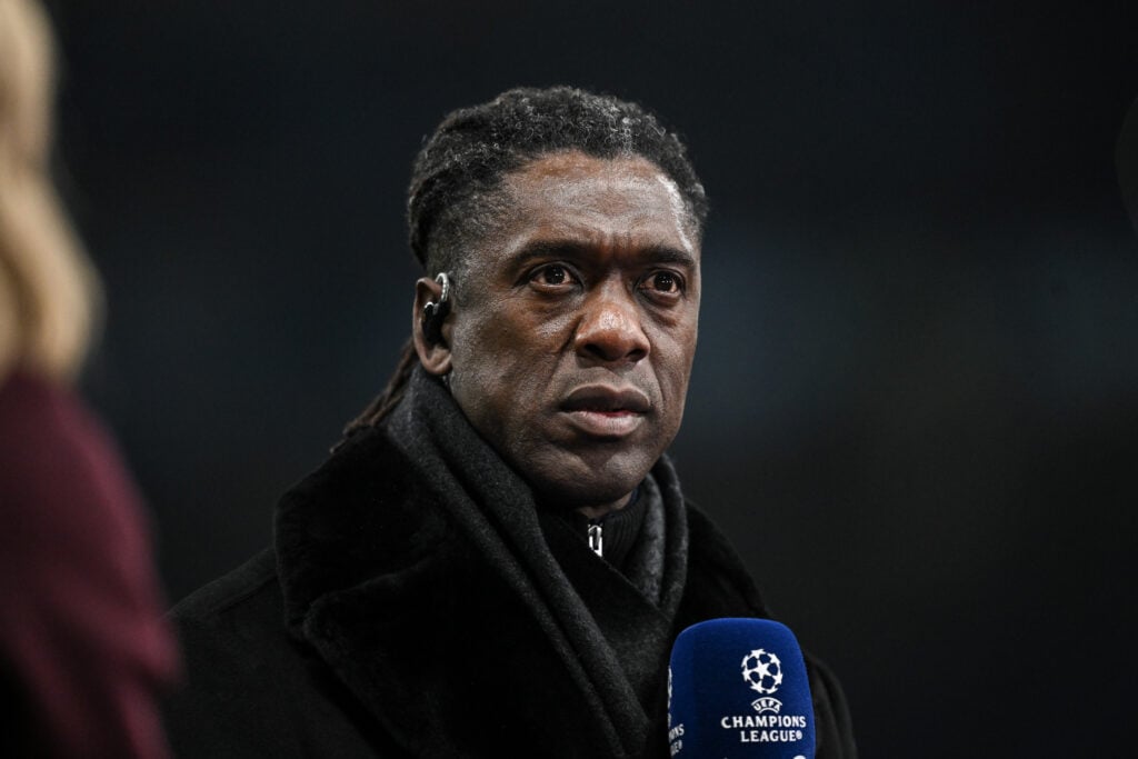 Clarence Seedorf holding microphone