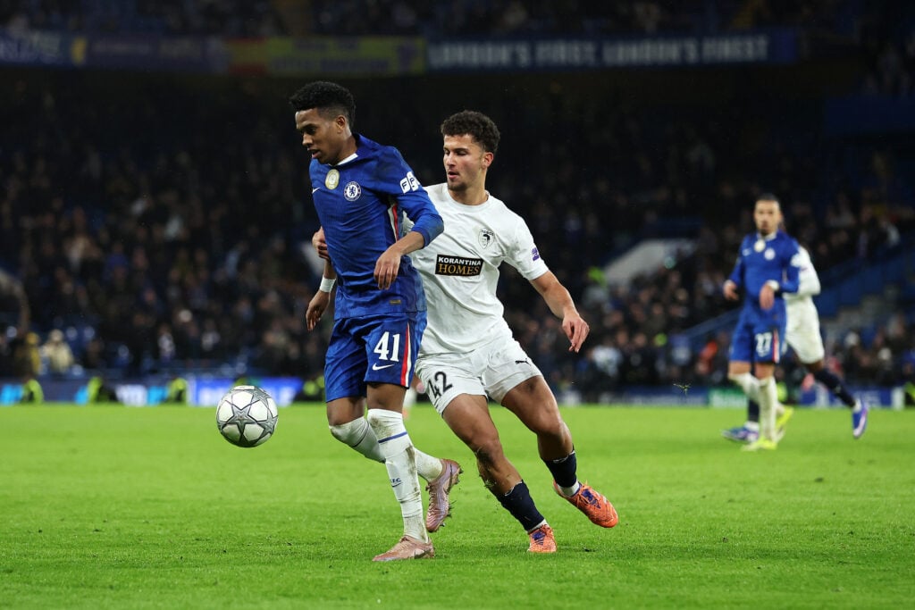 Estevao of Chelsea on the ball whilst under pressure from Georgios Michael of Pafos FC