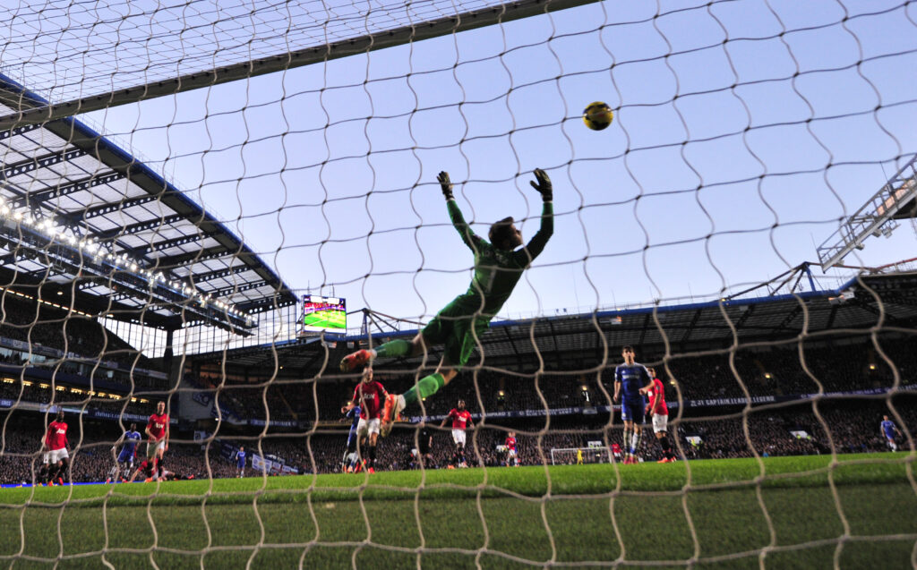 Chelsea's Cameroonian striker Samuel Eto'o scores the opening goal past Manchester United
