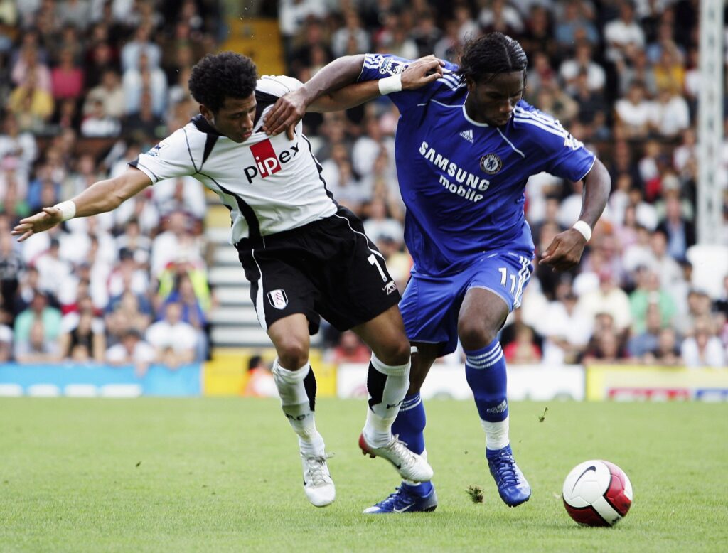 Didier Drogba competes for the ball with Liam Rosenior during the Barclays Premiership match between Fulham and Chelsea at Craven Cottage