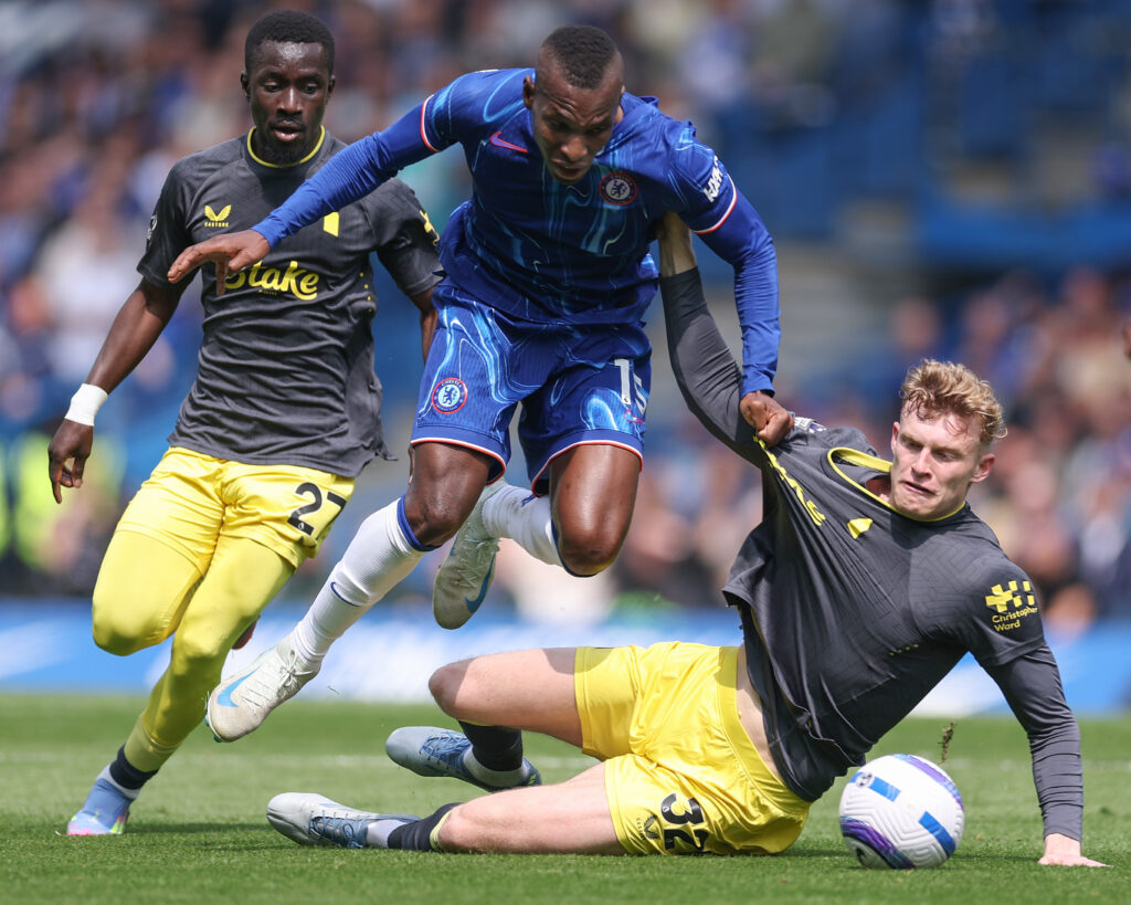 Nicolas Jackson of Chelsea is challenged by Jarrad Branthwaite of Everton