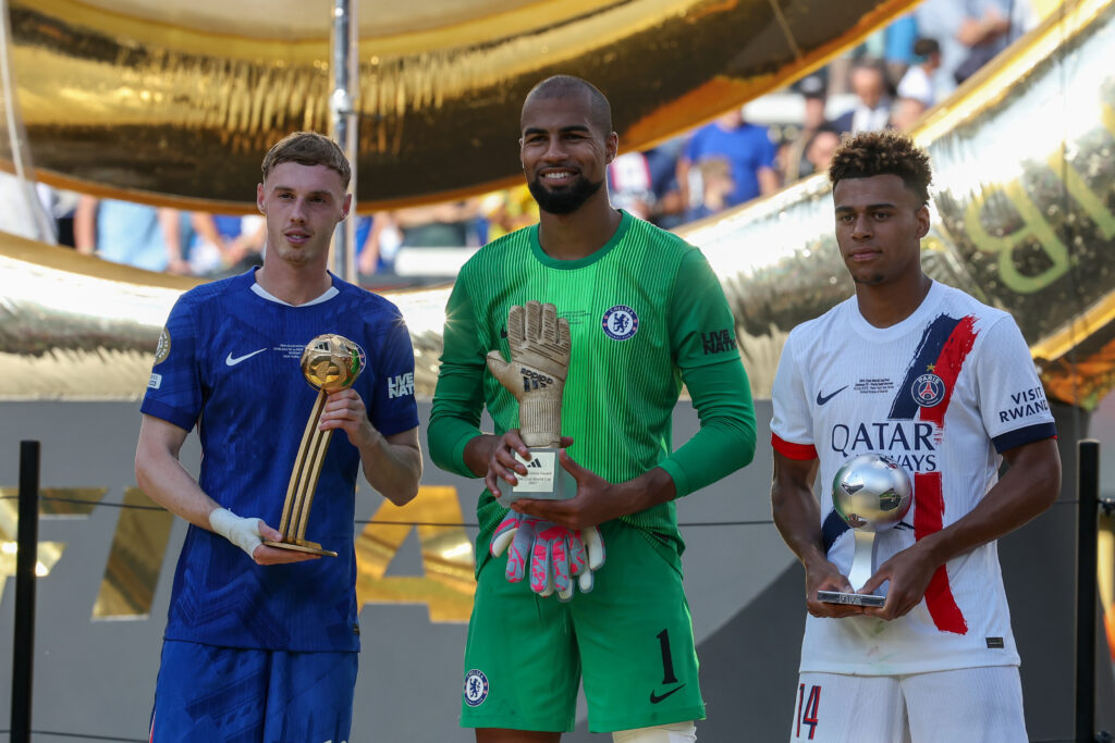 Chelsea midfielder Cole Palmer (10) stands with his Golden Ball award, Chelsea goalkeeper Robert Sánchez (1) stands with his Golden Glove award and Paris Saint-Germain midfielder Désiré Doué