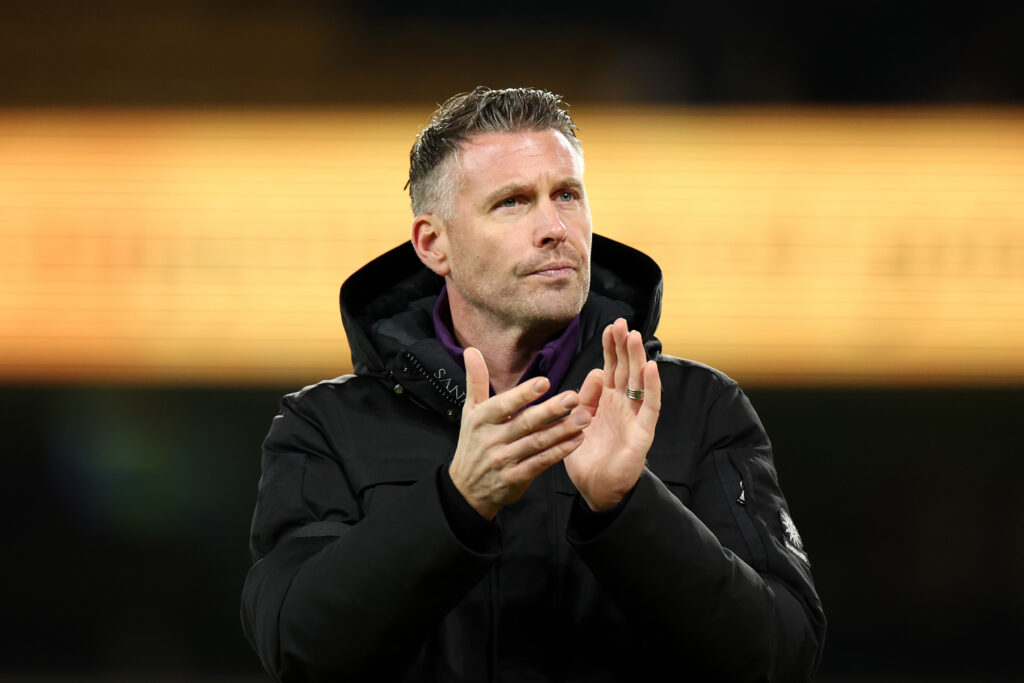 Rob Edwards applauds the Wolves fans.