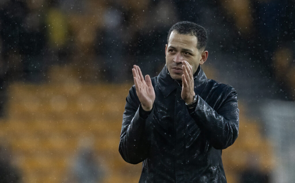 Chelsea's manager Liam Rosenior applauds his side's travelling supporters