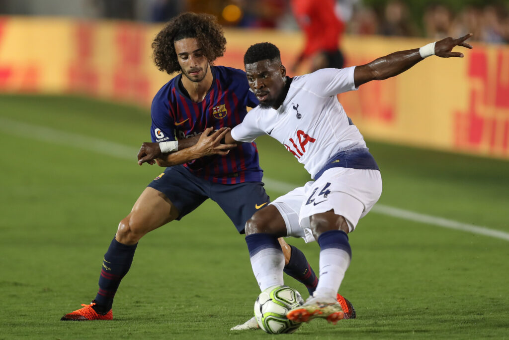Serge Aurier #24 of Tottenham Hotspur and Marc Cucurella #28 of FC Barcelona