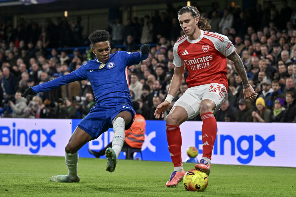 Riccardo Calafiori of Arsenal battles with Estevao of Chelsea