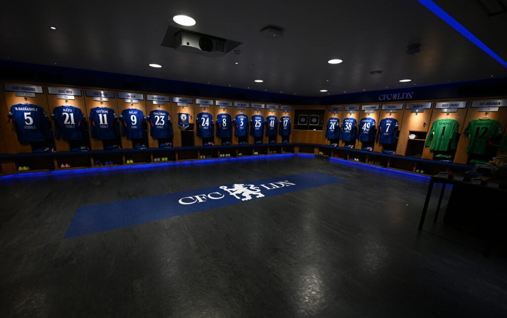 Interior view of Chelsea's Stamford Bridge dressing room with player shirts visible