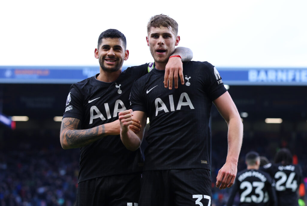 Micky van de Ven of Tottenham Hotspur celebrates scoring his team's first goal with teammate Cristian Romero