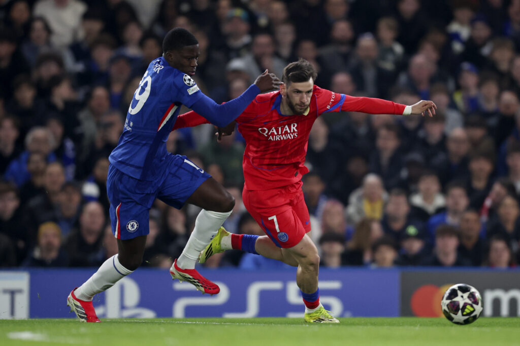 Mamadou Sarr of Chelsea cant stop Khvicha Kvaratskhelia of Paris Saint-Germain