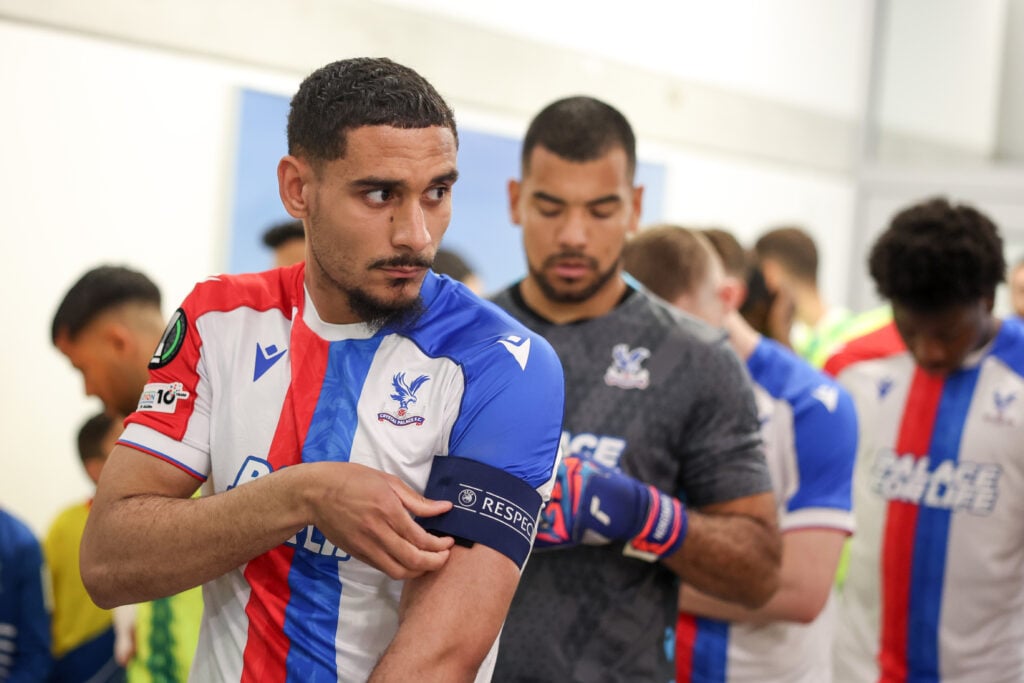 Maxence Lacroix of Crystal Palace adjusts his captains armband