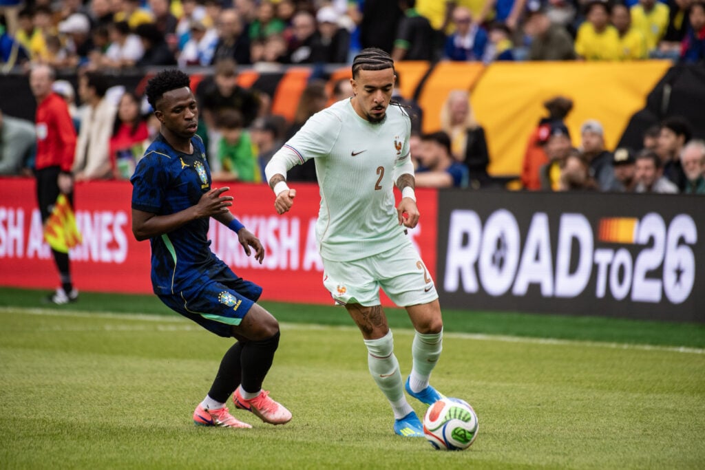 Franceâs Malo Gusto (2) controls the ball during an international pre-World Cup friendly match between Brazil and France