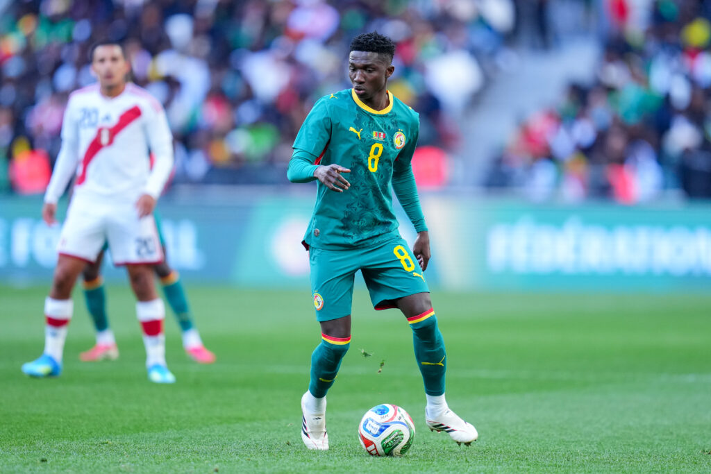 Lamine Camara of Senegal controls the ball