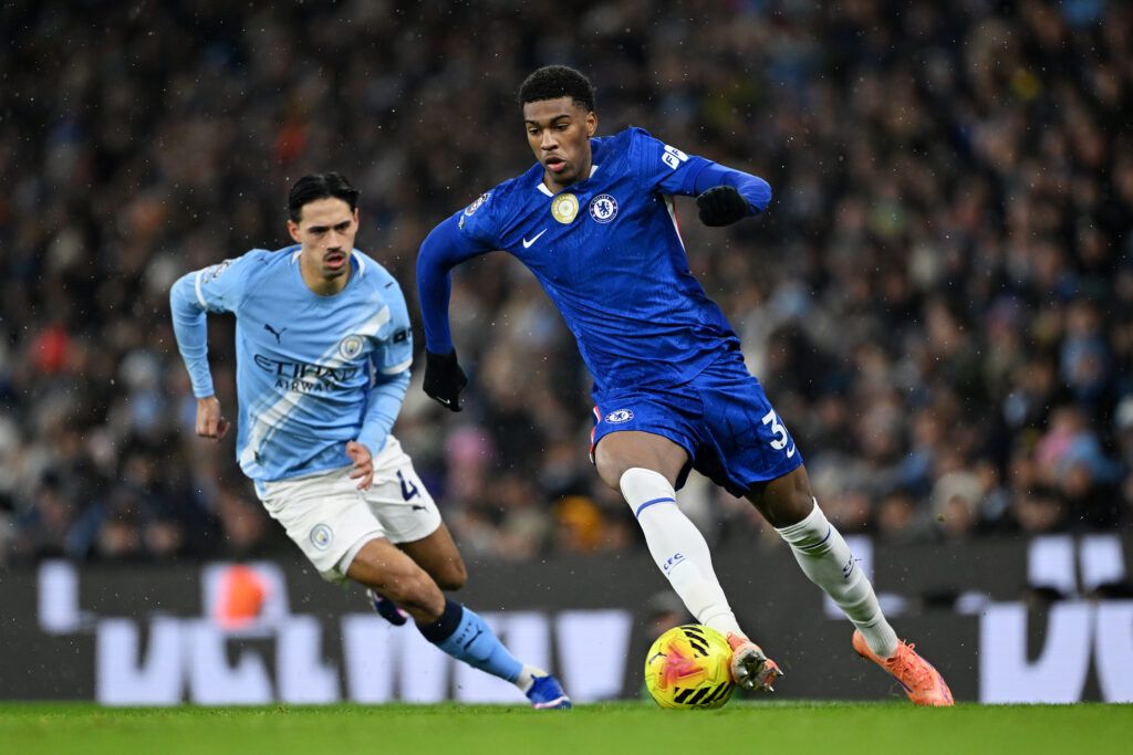 Josh Acheampong of Chelsea runs with the ball