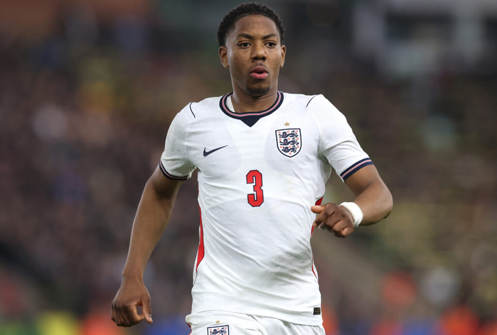 Myles Lewis-Skelly of England looks on