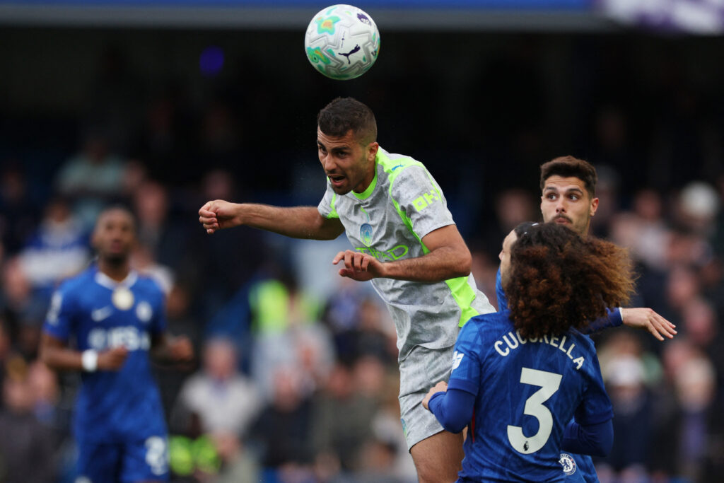 Manchester City's Spanish midfielder #16 Rodri jumps