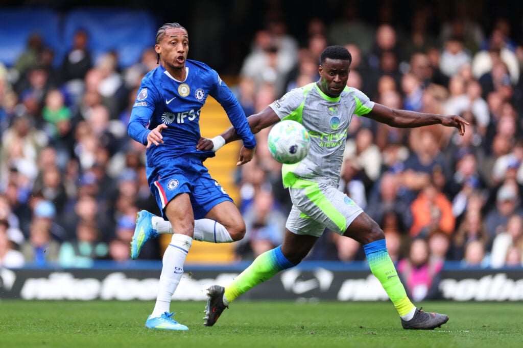 Joao Pedro of Chelsea in action with Marc Guehi of Manchester City