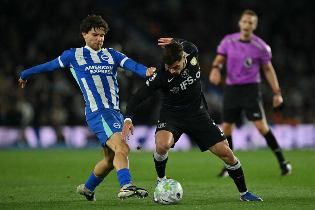 Brighton's Turkish defender #24 Ferdi Kadioglu (L) vies with Chelsea's Portuguese midfielder #07 Pedro Neto (R)