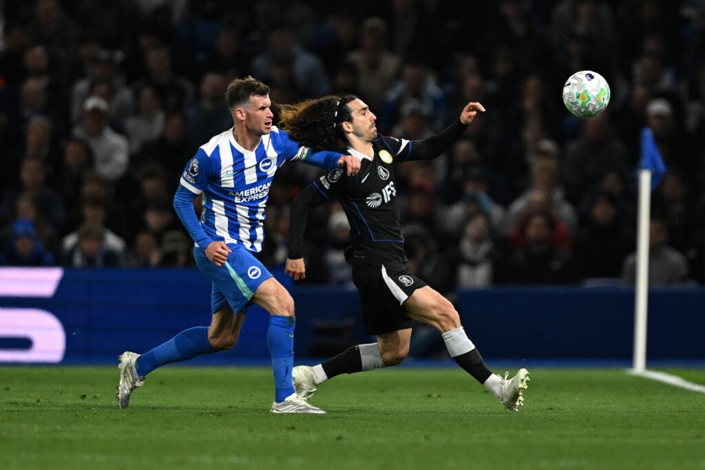 Marc Cucurella of Chelsea is challenged by Pascal Gross