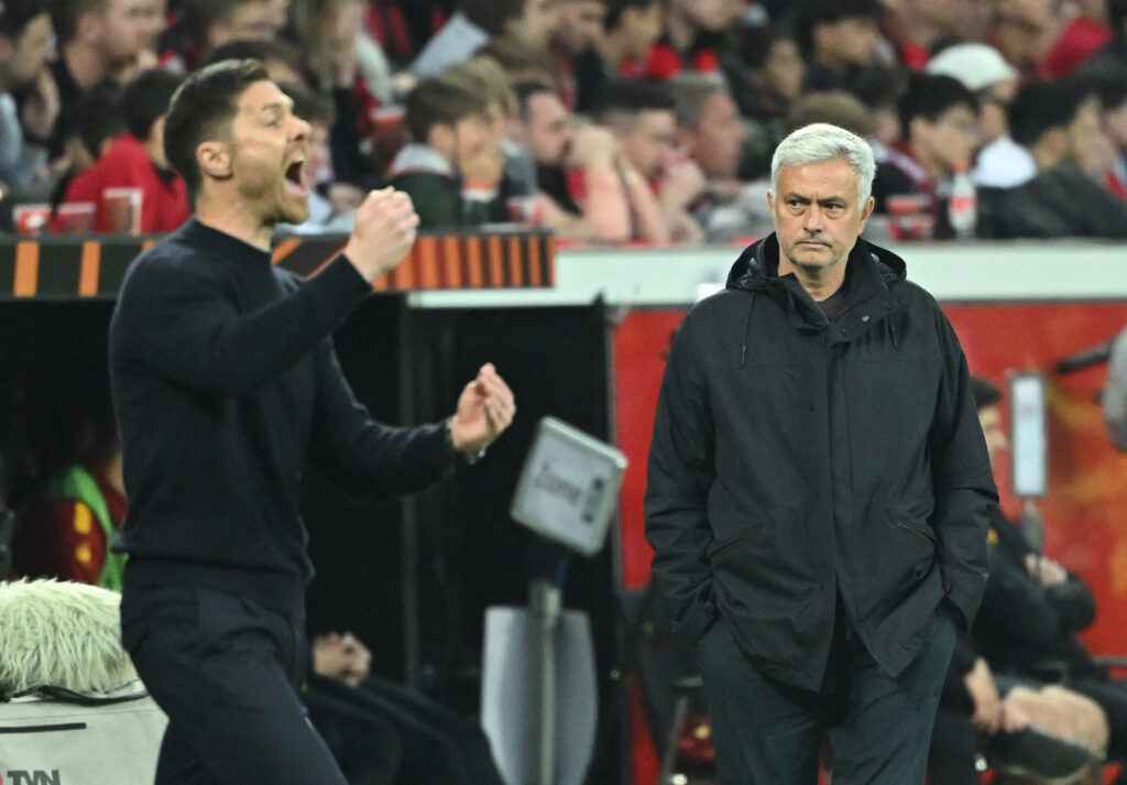 Bayer Leverkusen's Spanish coach Xabi Alonso gestures next to AS Roma's Portuguese coach Jose Mourinho