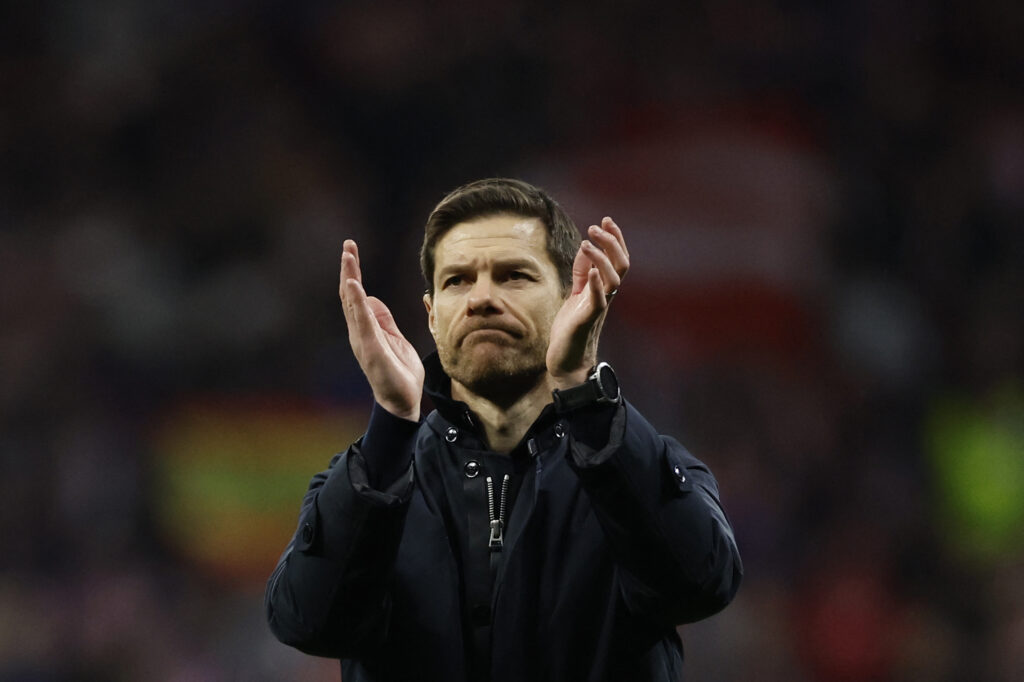Bayer Leverkusen's Spanish coach Xabi Alonso claps