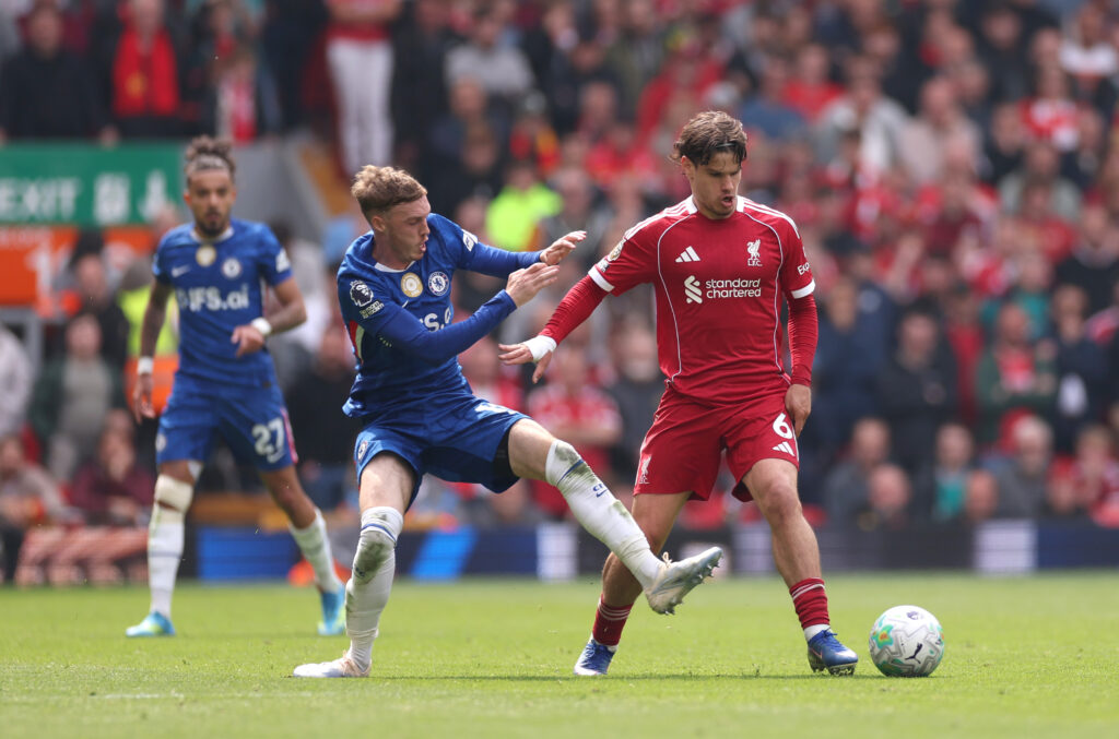 Milos Kerkez of Liverpool is challenged by Cole Palmer of Chelsea