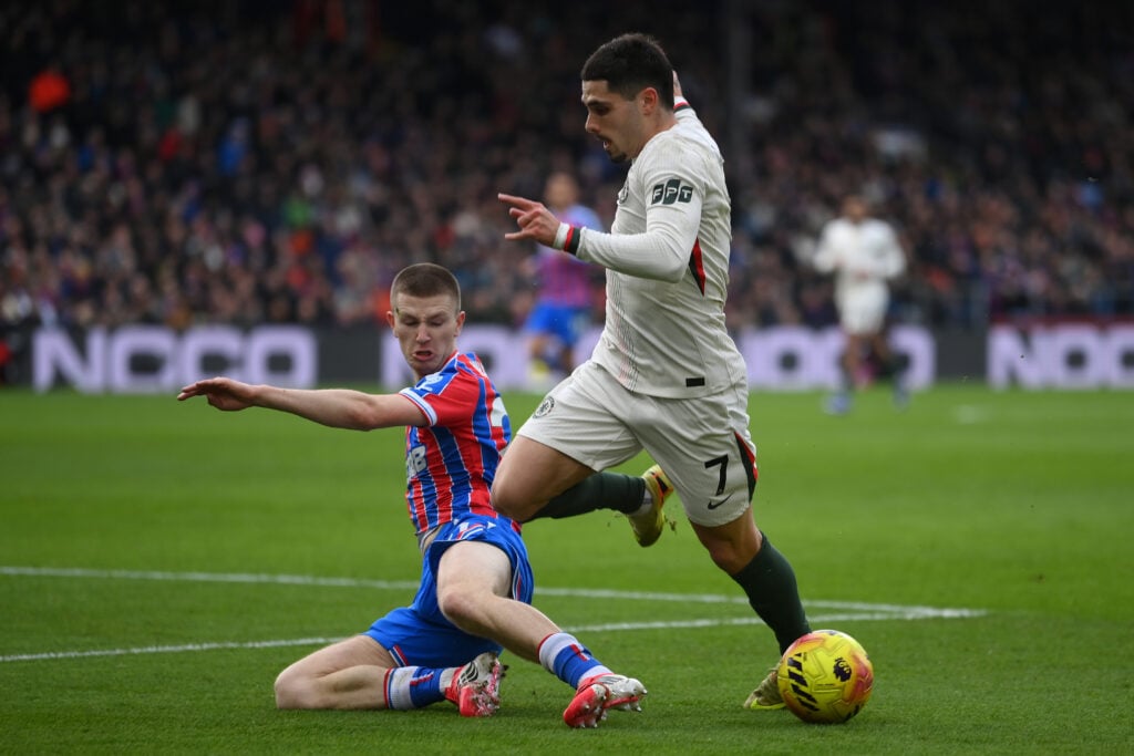Pedro Neto of Chelsea is tackled by Adam Wharton of Crystal Palace