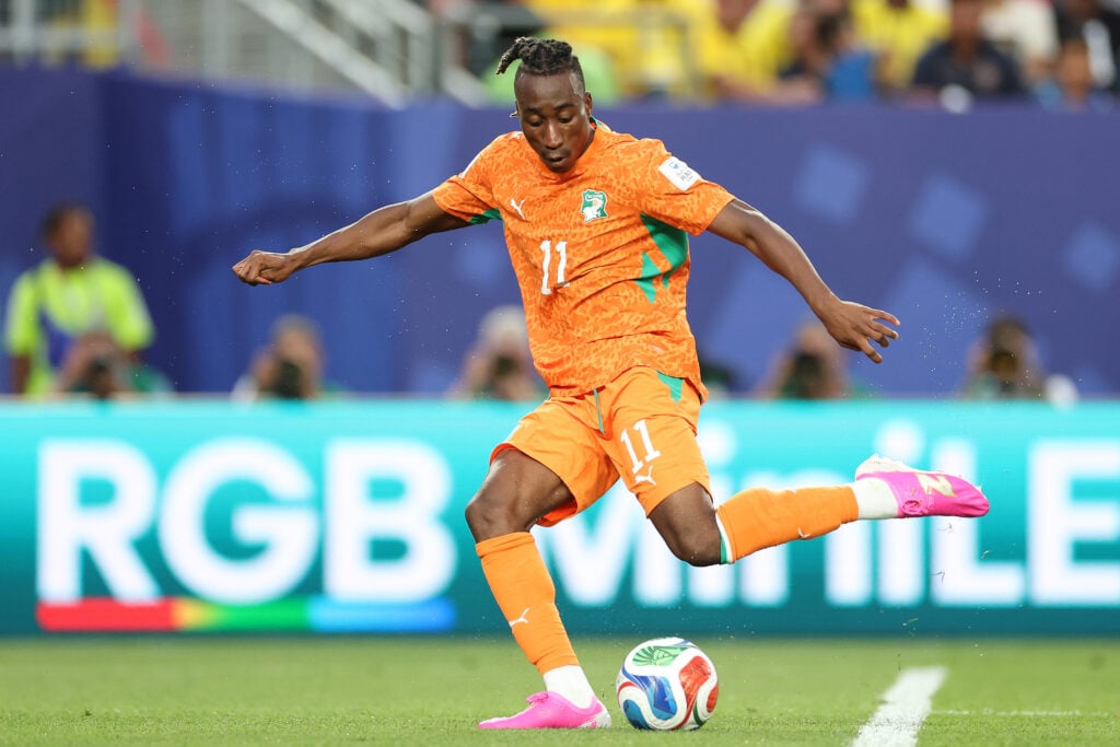 Yan Diomande #11 of Cote d'Ivoire passes the ball