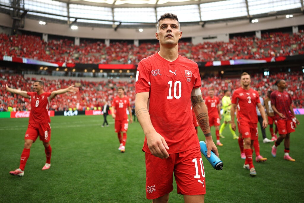 Granit Xhaka #10 of Switzerland reacts