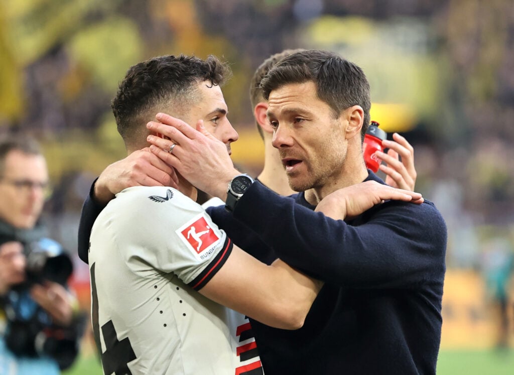 Xabi Alonso, Head Coach of Bayer Leverkusen, and Granit Xhaka of Bayer Leverkusen celebrates