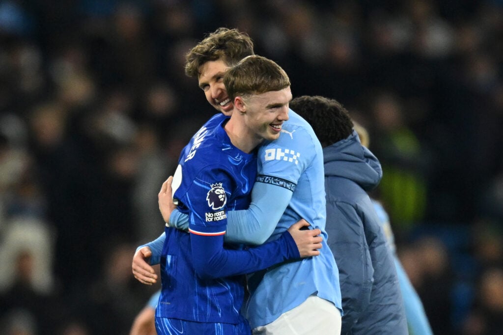 Cole Palmer of Chelsea and John Stones of Manchester City