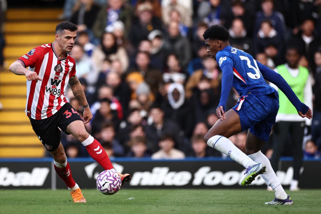 Chelsea's English defender #34 Josh-Kofi Acheampong (R) vies with Sunderland's Swiss midfielder #34 Granit Xhaka (L)