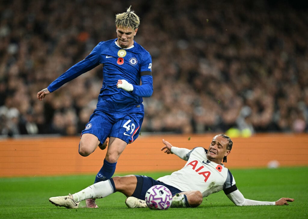 Tottenham Hotspur's Dutch midfielder #07 Xavi Simons (R) fouls Chelsea's Argentinian midfielder #49 Alejandro Garnacho