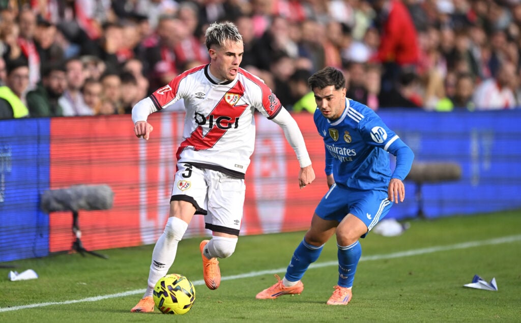Pep Chavarria of Rayo Vallecano is challenged by Brahim Diaz of Real Madrid