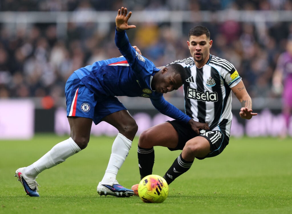 Moises Caicedo of Chelsea battles for possession with Bruno Guimaraes of Newcastle United