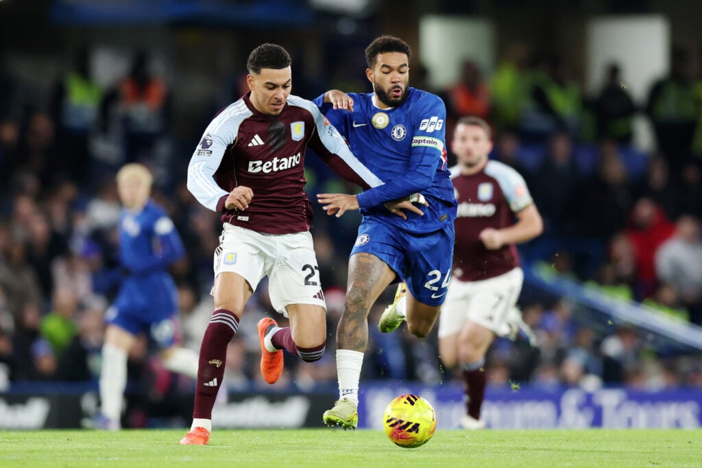 Reece James of Chelsea battles for possession with Morgan Rogers of Aston Villa
