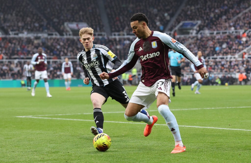 Morgan Rogers of Aston Villa battles for possession with Lewis Hall of Newcastle United