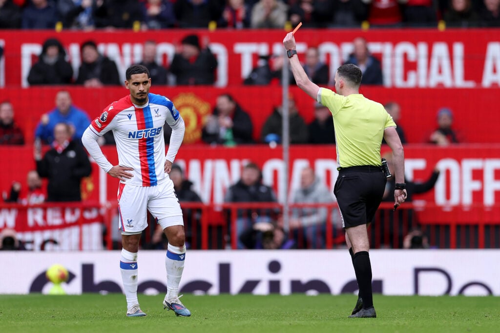 Referee Chris Kavanagh shows a red card to Maxence Lacroix of Crystal Palace