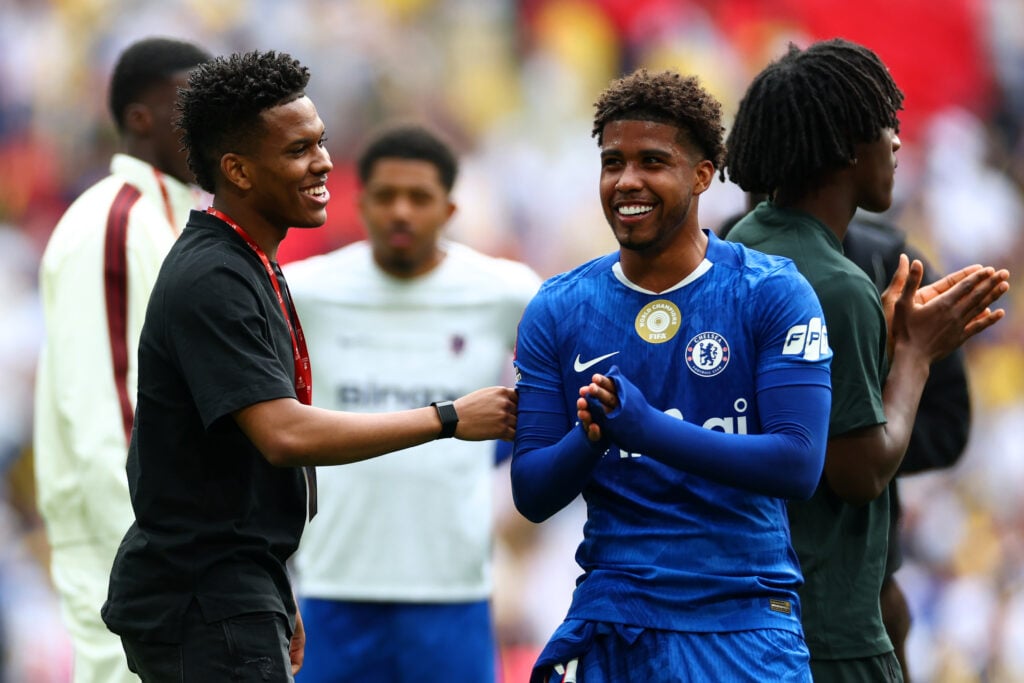 Estevao (L) of Chelsea reacts next to team-mate Andrey Santos