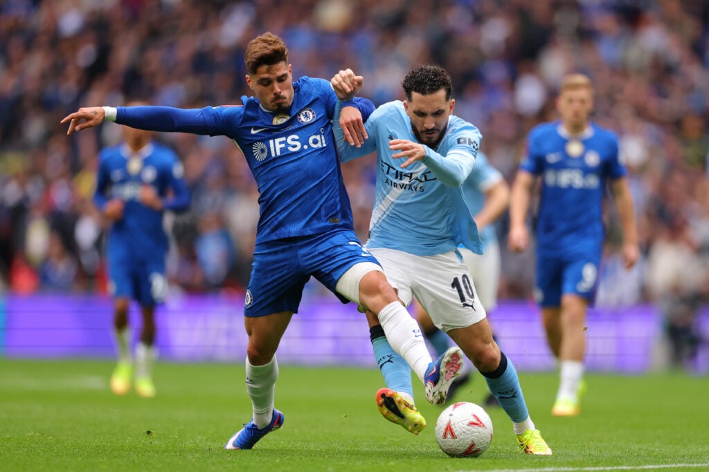 Pedro Neto of Chelsea challenges Ryan Cherki