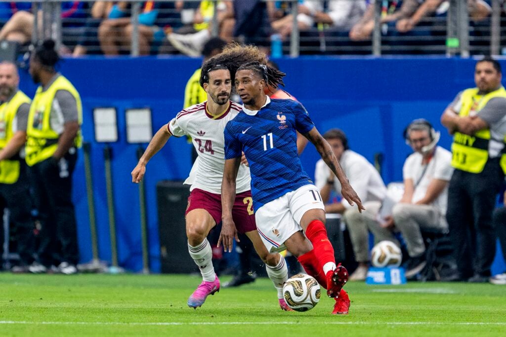 Marc Cucurella of Spain and Michael Olise of France