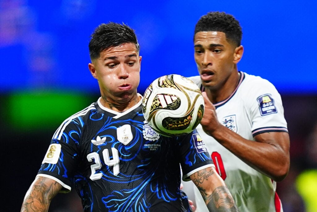 Enzo Fernandez (L) of Argentina in action against Jude Bellingham of England