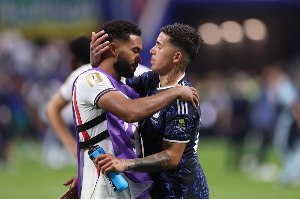 Reece James of England embraces Enzo Fernandez of Argentina